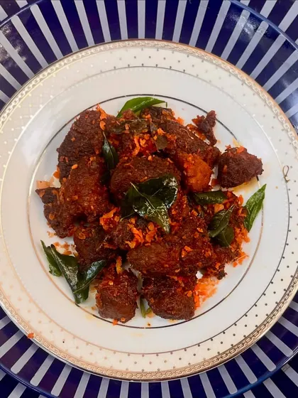 We've captured the essence of Angamaly's iconic pork fry for our Christmas menu. Slow-cooked in a manchatti, tender pork cubes are infused with bold masalas and a hint of vinegar for a smoky, rustic flavour.