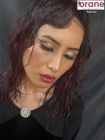 Another view of the wet-look makeup, showing how it catches the light to create a radiant effect.