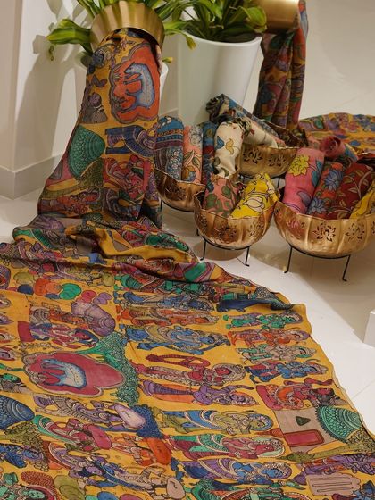 This is a glimpse into my Kalamkari Edition, featuring a wide array of hand-painted dupattas and fabrics from the Indralokam series. Each piece is a unique story, available for you to customize into your dream outfit.