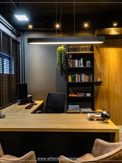 A glimpse into a high-end office cabin we designed in BKC, Mumbai. The design features dark, moody tones, a statement pendant light, and an efficient L-shaped desk, proving that professional luxury can be achieved within a budget.