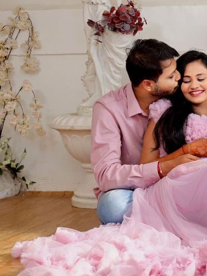 A romantic couple's portrait in our pink ruffled Clara gown. This dress is perfect for creating a soft, dreamy, and love-filled atmosphere.