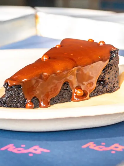 A vegan, flourless, and sugar-free chocolate cake that looks incredibly decadent. A good photo is essential to convince customers that "healthy" can also be delicious.