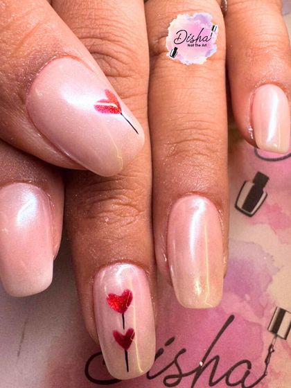 A simple and romantic design with a pearlescent pink base and tiny, hand-painted red hearts.