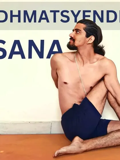 Ardha Matsyendrasana (Half Lord of the Fishes Pose) is a seated twist named after the founder of Hatha yoga. It increases spinal flexibility and stimulates digestive organs.