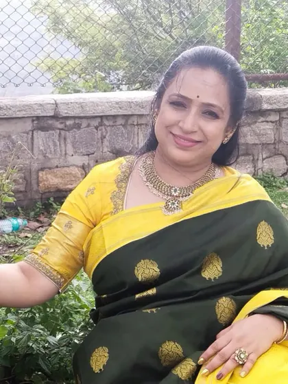A happy client enjoying her beautiful Kanjivaram silk saree, a piece of unmatched craftsmanship.