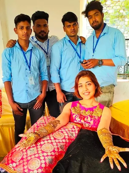 A happy client posing with me and my team after her bridal mehendi session. We are dedicated to making your day special.