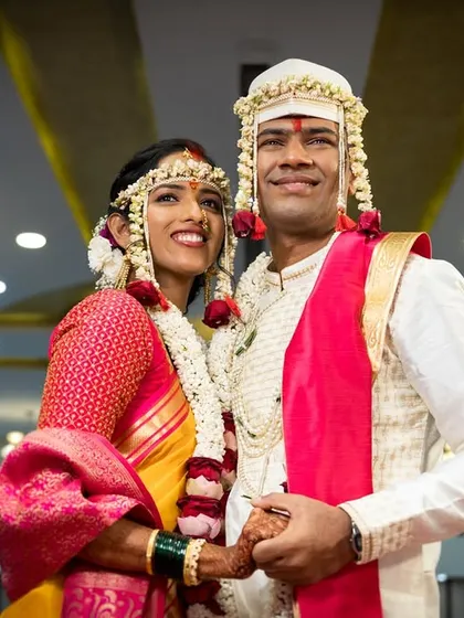 A classic portrait of the bride and groom in their traditional wedding attire.