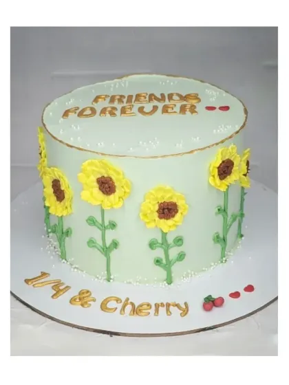 A charming sunflower cake with a chocolate hazelnut flavor. The hand-piped sunflowers on a pale green background create a fresh and cheerful design for "Friends Forever."