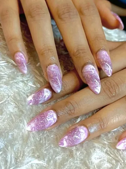 A beautiful marble design using pink and white with a touch of glitter. This creates a rose quartz-like effect that is both elegant and on-trend.