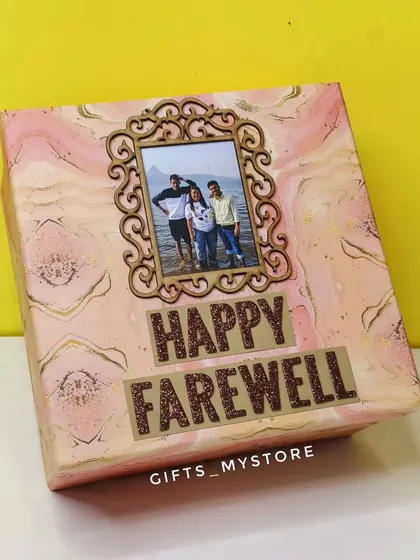 A personalised explosion box with a "Happy Farewell" message. The box opens up to reveal photos and messages, making it a surprise-filled gift.