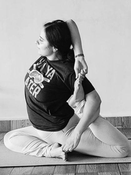 A beautiful black and white shot of a seated backbend. This pose opens the shoulders and chest while providing a deep stretch for the quadriceps.