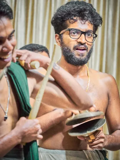 The 'Ilathalam' or cymbals are crucial for keeping the beat and adding a metallic shimmer to the ensemble's sound. Here's one of our artists in action.