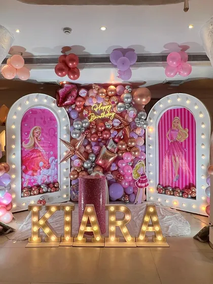 For the ultimate Barbie fan, I designed this glamorous pink and silver birthday stage. It features light-up panels with Barbie silhouettes, a metallic balloon wall, and the birthday girl's name and age in large marquee letters.