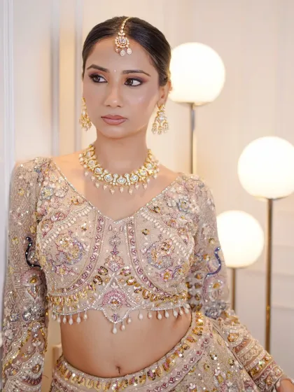 A full view of the beautifully embroidered blouse, paired with a simple kundan choker.