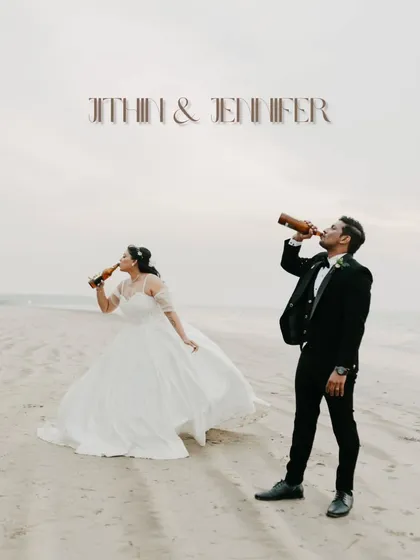 A fun and unconventional wedding portrait of Jithin and Jennifer on the beach. Sharing a drink together in their wedding attire shows their playful personalities and adds a unique touch to their wedding album.
