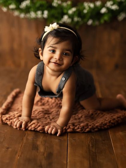 Capturing the magic of innocence. This little one is crawling towards the camera with the sweetest smile.