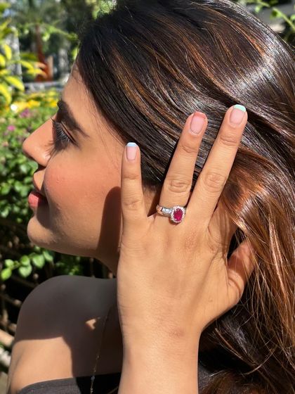 The perfect pairing of a ruby ring and matching floret earring, showcasing a complete and elegant look.