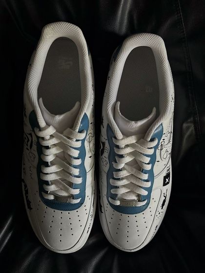 A front view of the personal doodle custom sneakers.