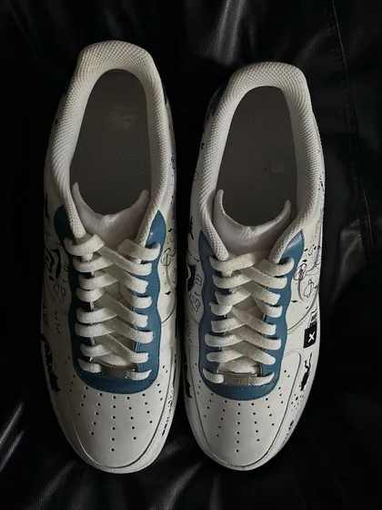 A front view of the personal doodle custom sneakers.