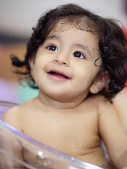 A close-up of that happy, bubbly face. The pure joy of a splash session is wonderful to capture.