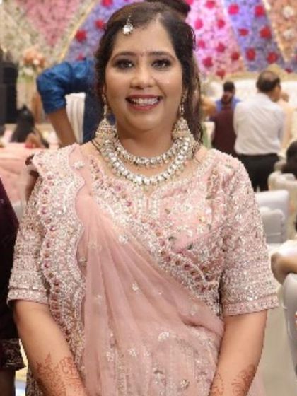 A close-up portrait of the sister of the groom.
