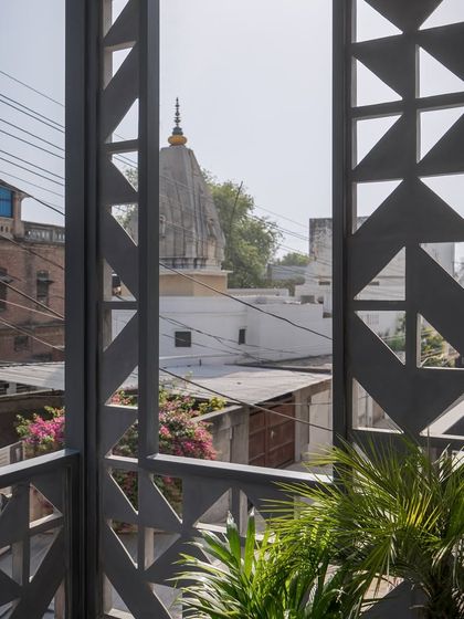 The facade of Hikari House, with its custom cast-concrete screen. This modular screen, assembled like Tetris blocks, mediates light, airflow, and privacy, anchoring the home within its dense urban context.