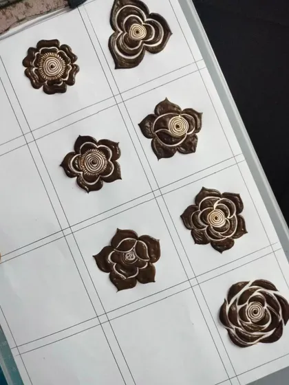 A practice grid for mastering different types of floral motifs. By drawing the same element multiple times, you build consistency and confidence in your work.