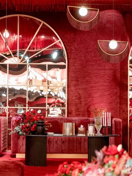 A lounge area at 'Le Rouge', where modern fringe lamps and distorted mirrors play with light and reflection. The design was all about creating the right mood and a sophisticated aesthetic.