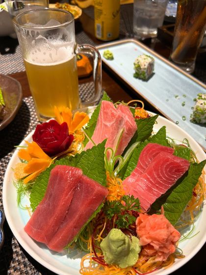 The perfect pairing: a cold beer and a plate of our finest tuna sashimi. The rich flavor of the Akami and Chutoro cuts is beautifully complemented by a crisp drink.