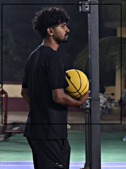 A focused shot of a coach during a session. Our team is passionate about the game and dedicated to the development of our players.