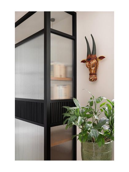 Another view of the study pod screen, which uses different textures of glass and metal to create a sense of privacy while still allowing light to pass through. It's a modern solution for creating a work-from-home space.