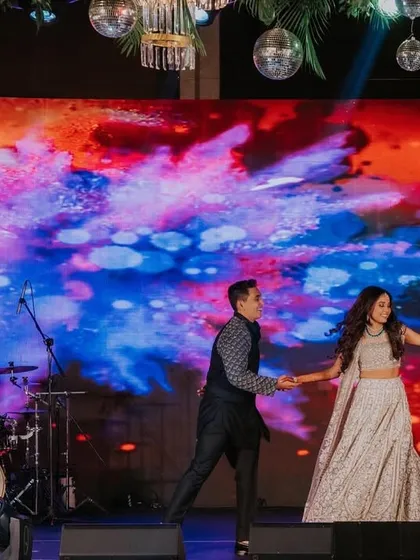 Sometimes the simplest moments are the most beautiful. Against a vibrant, abstract LED backdrop, this couple's performance was a testament to their simple and modest love story, told through graceful movement.
