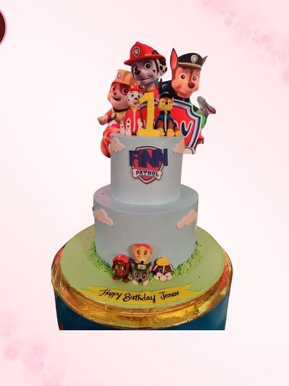This two-tiered PAW Patrol cake is ready for action. It's decorated with the brave pups from the popular show, making it an exciting centerpiece for a young hero's birthday party.