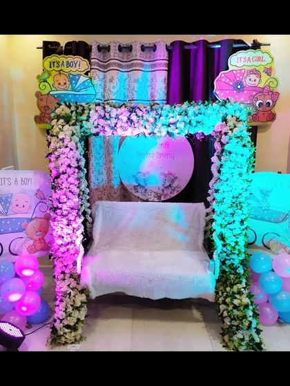 The home baby shower setup with pink and blue lighting, creating a different vibrant look. I can customize the lighting to match your preference.