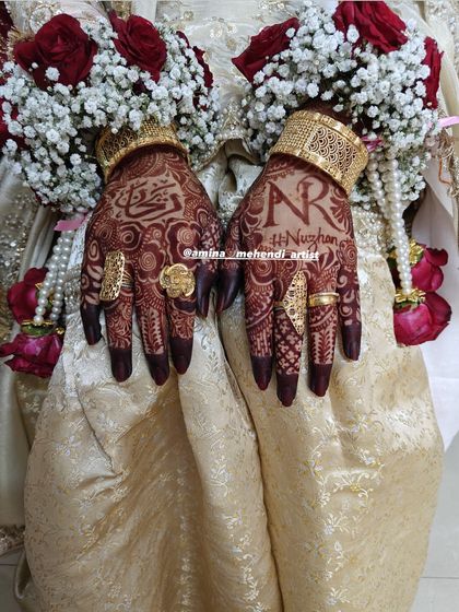 The rich henna stain looks stunning paired with bridal jewelry. This photo shows the one-day stain with the bride's beautiful rings and bracelets.