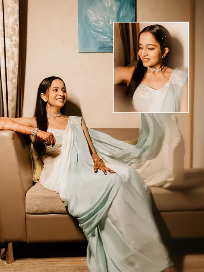 A modern bridal portrait. The bride looks elegant in her light blue saree, with an inset close-up capturing her happy, sparkling smile.