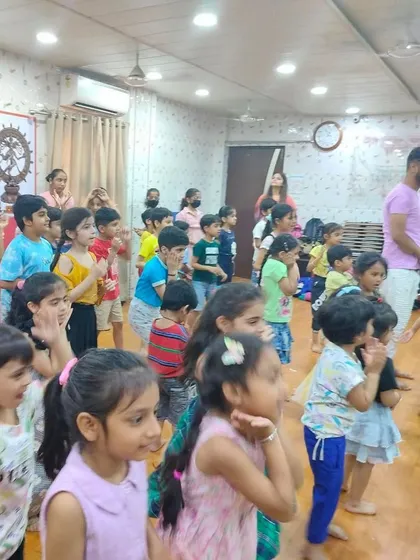A group of children of various ages participating in a dance class. This highlights the inclusive and welcoming environment of our summer camp activities.