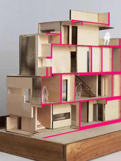 A sectional model of the LUCID House, made from balsa wood. This model was crucial for studying the interplay of volumes, the triple-height light well, and the circulation paths within the home.