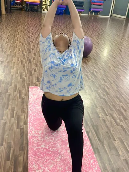 A variation of the low lunge pose, reaching upwards to open the chest and lengthen the spine.