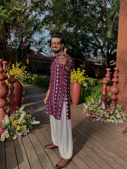 A final, confident pose in my maroon outfit.