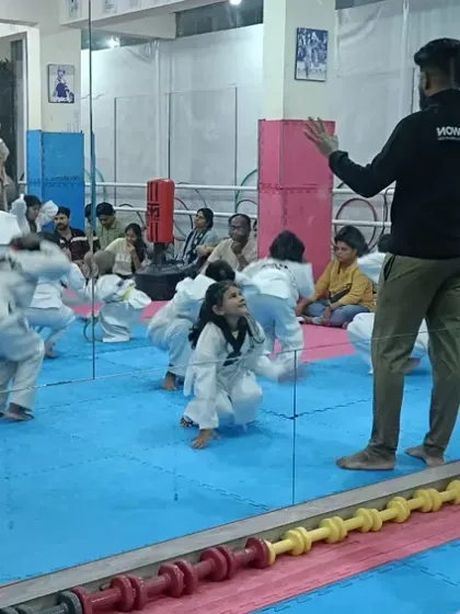 Instructors demonstrating an exercise to the class.
