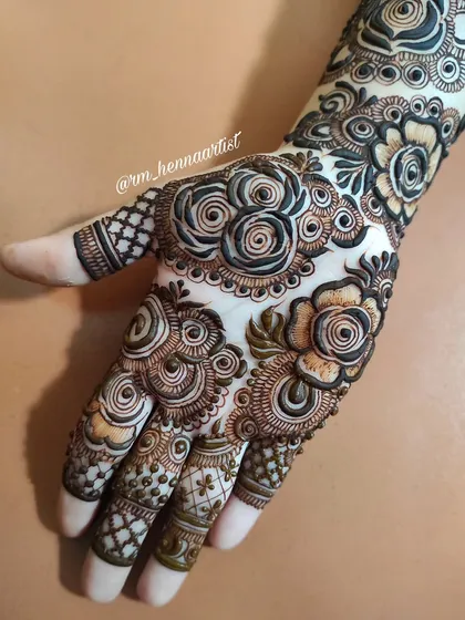 A still shot of this gorgeous, heavy design filled with swirling roses and detailed patterns. It's a design that is sure to get compliments.