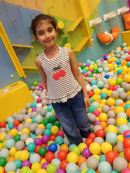 Posing for a photo amidst the fun. Our play zone is full of picture-perfect moments.