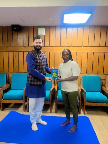 Presenting a book to a student from our international teacher training program in Noida.