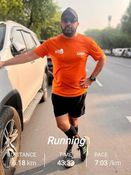 A member looking strong after a 6km run, with the stats to prove it. We use apps like Garmin to track our progress and stay motivated.