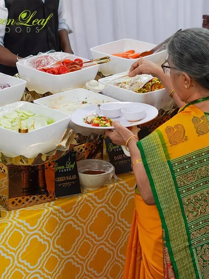 A guest enjoys our fresh salad bar. We offer a variety of healthy and delicious options to ensure that every dietary preference is catered to with the same level of quality and flavor.
