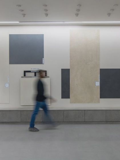 More images from the Krsimar marble showroom, detailing the sliding panel display system and the clean, spacious layout designed for an optimal client experience.