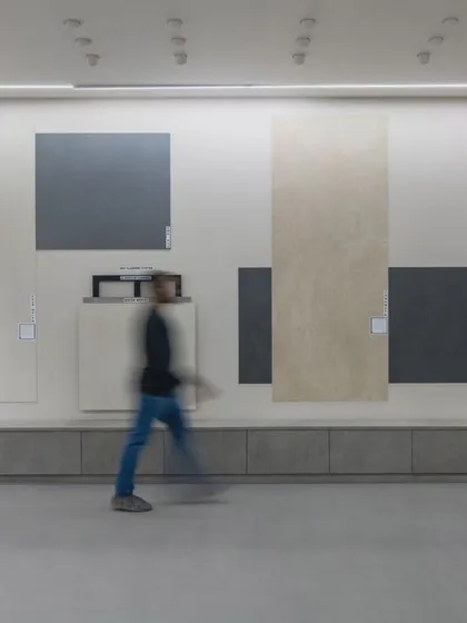 More images from the Krsimar marble showroom, detailing the sliding panel display system and the clean, spacious layout designed for an optimal client experience.