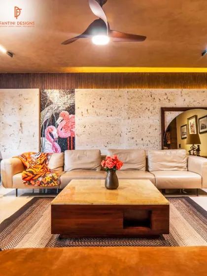 I love bringing a client's personality into their home. This living room combines earthy tones and natural textures with a pop of color from the flamingo mosaic art. The result is a warm, inviting space that is full of character.