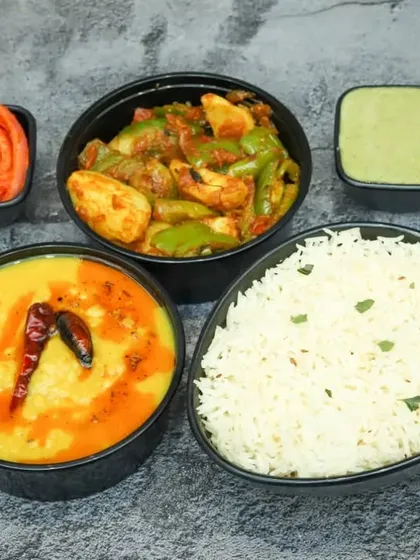 A perfect example of my Half Meal plan. This combo includes a flavourful Dal Tadka, a seasonal dry vegetable sabzi, and fluffy steamed rice, served with a side of chutney and salad.